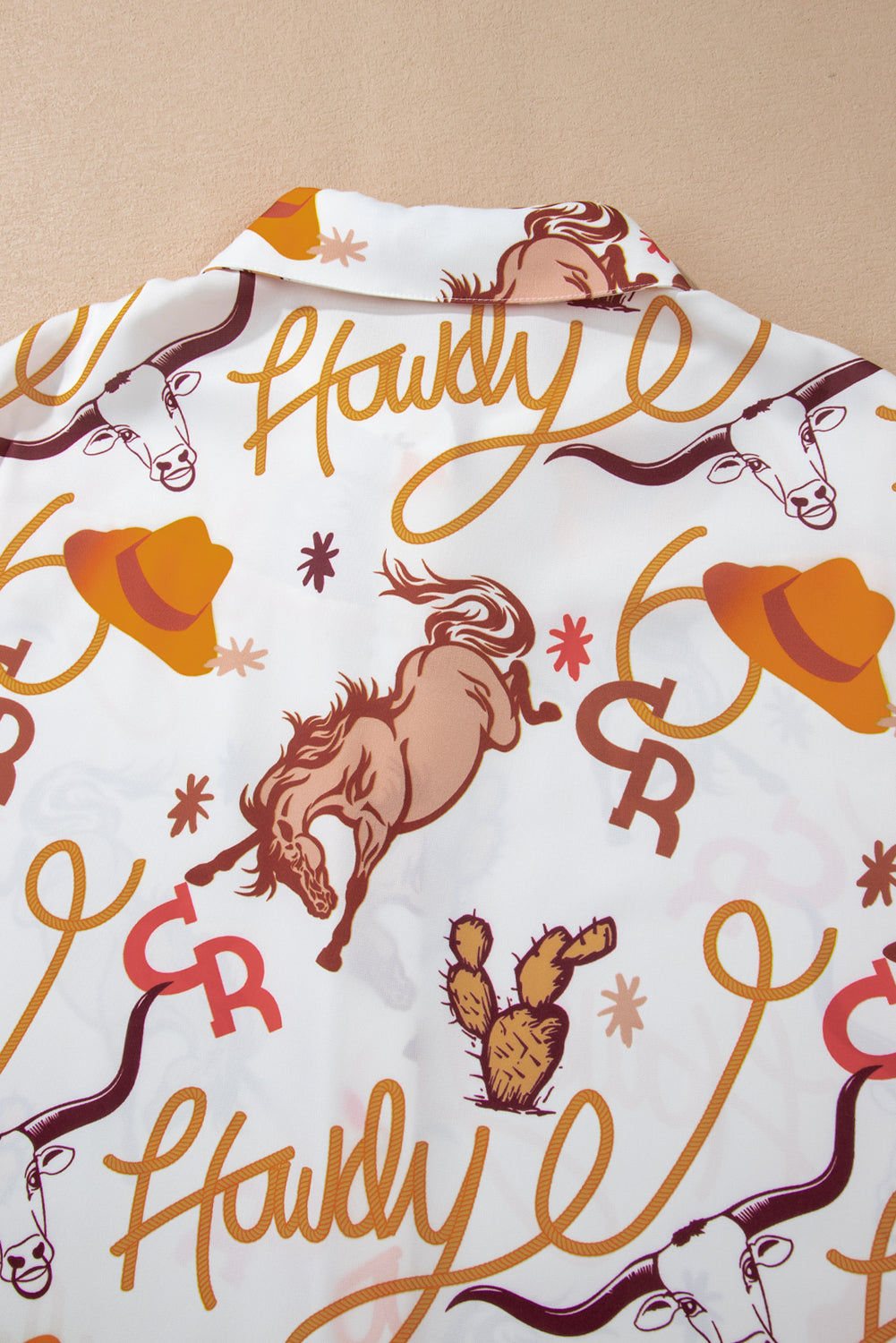 Camisa solta com botões e estampas ocidentais bege howdy